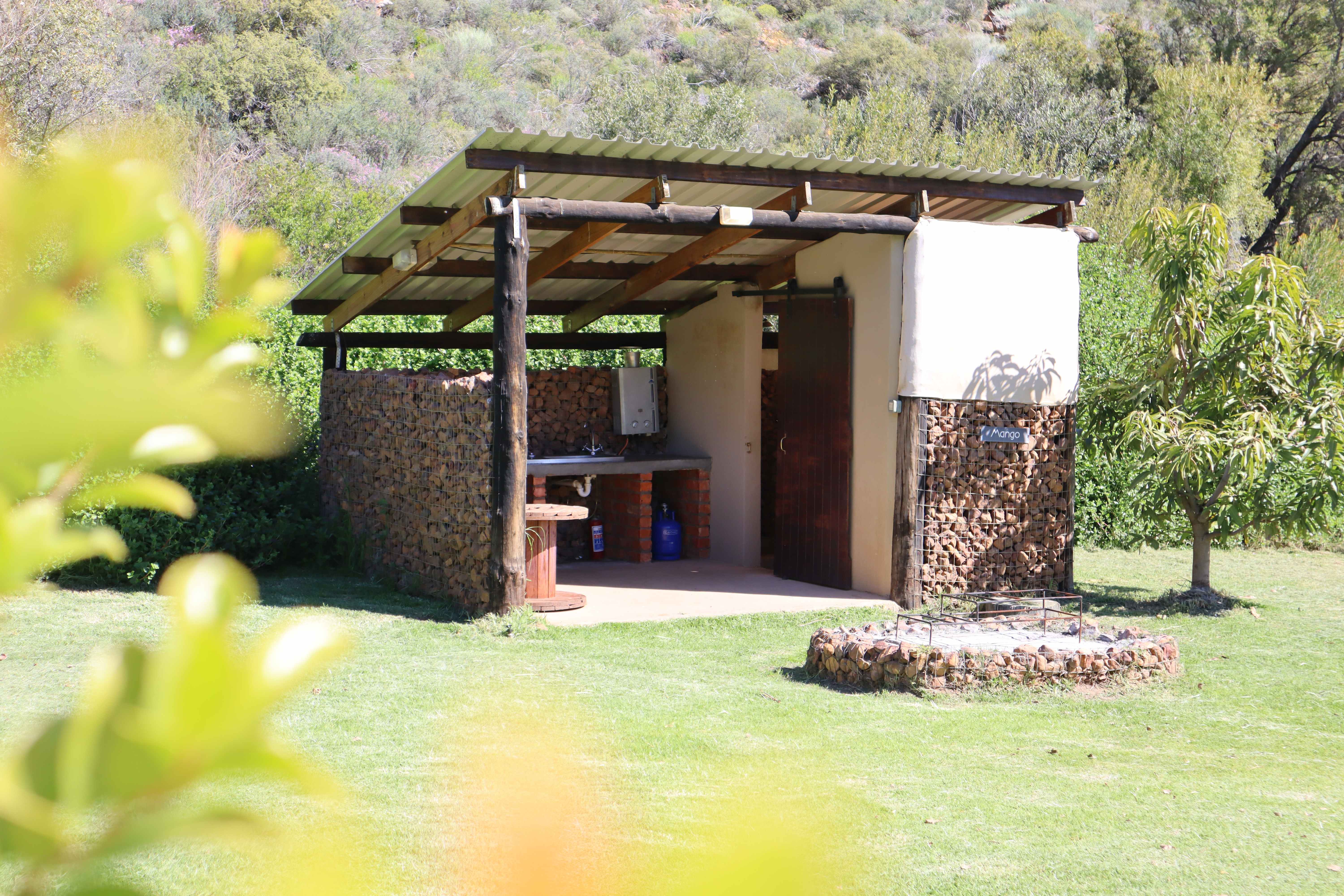 Mango campsite ablution facility with stone construction and cooking area