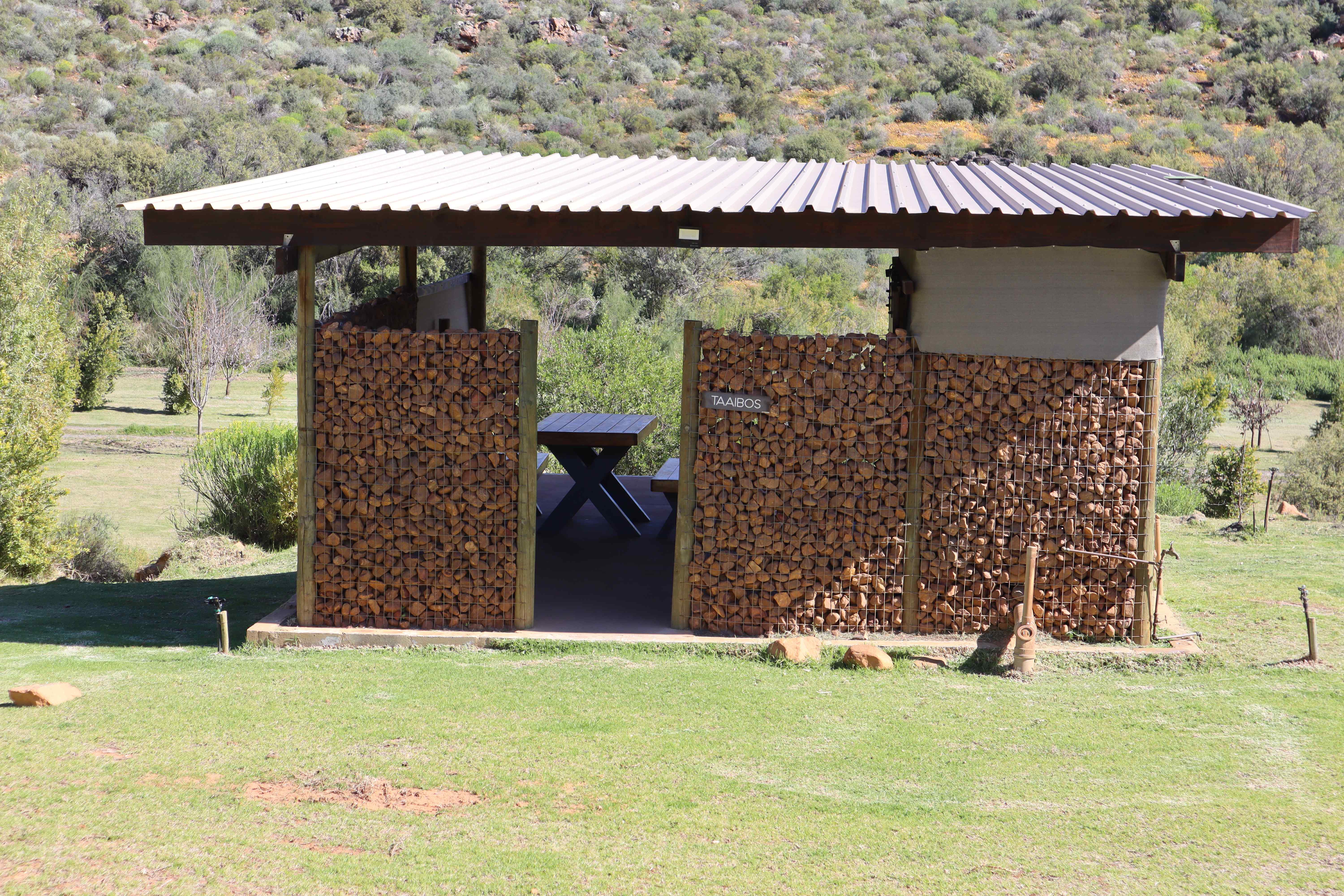 Taaibos campsite ablution facility with integrated firewood storage and modern design