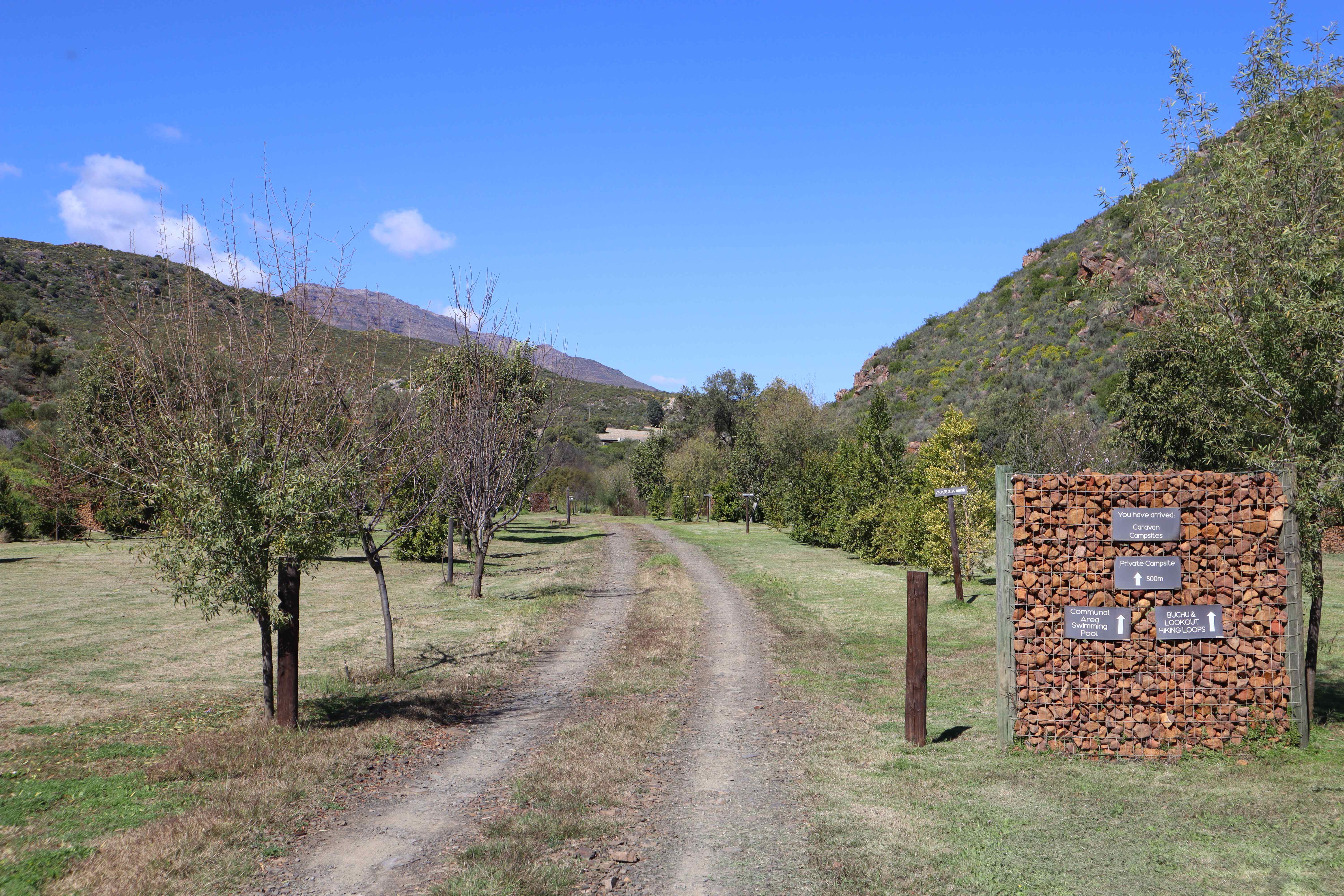 Kriedouw campsite entrance with rustic wooden signage