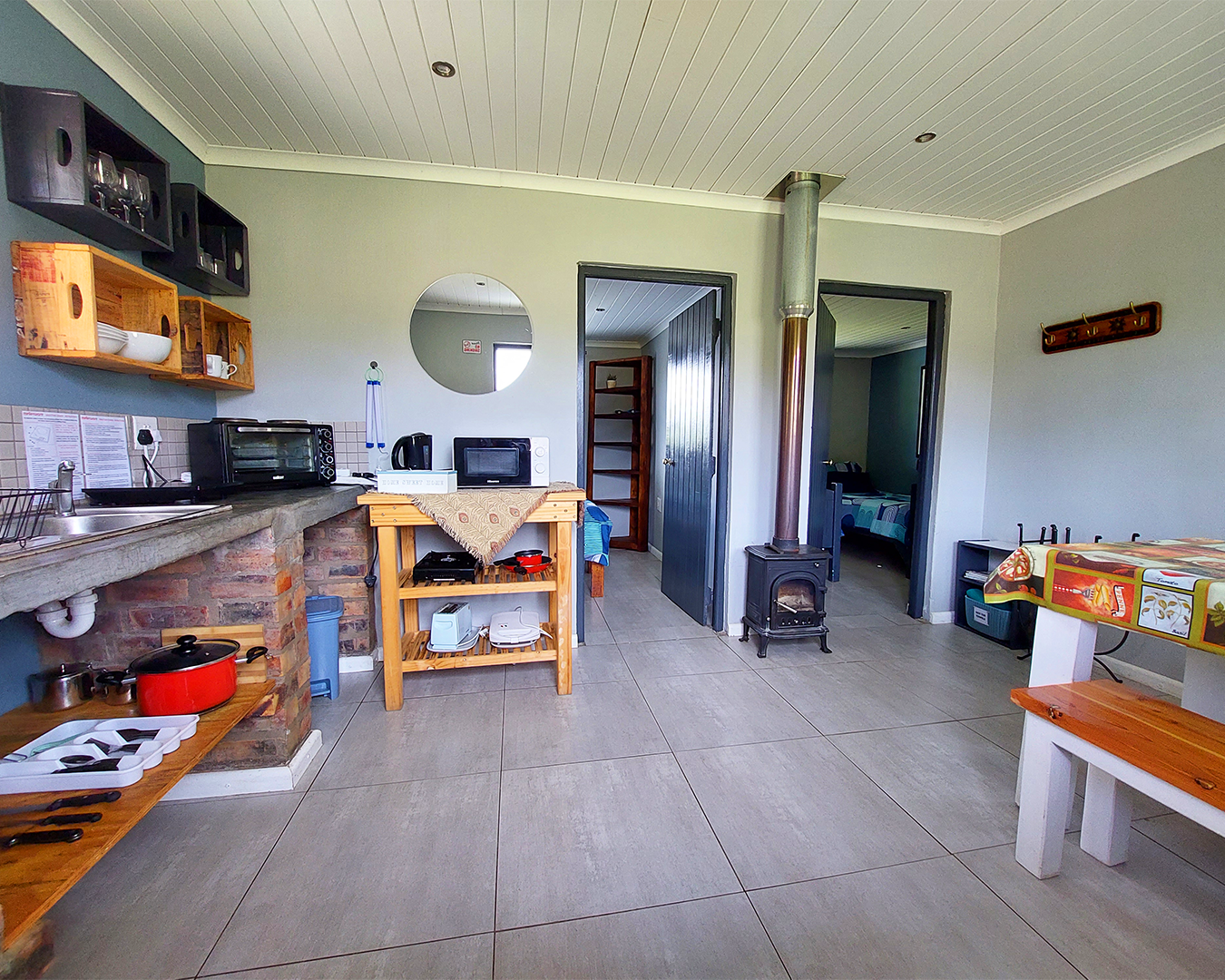 Farm cottage kitchen and dining area with wood-fired stove